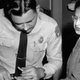 Rosa Parks is fingerprinted by police Lt. D.H. Lackey in Montgomery, Ala., after refusing to give up her seat on a bus for a white passenger on Dec. 1, 1955